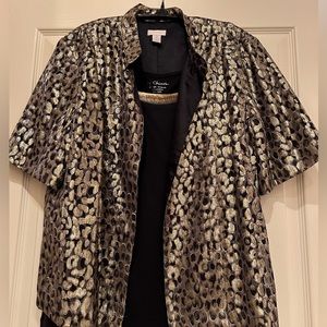 Chicos Gold lightweight cover and black tank top with gold fringe on top.